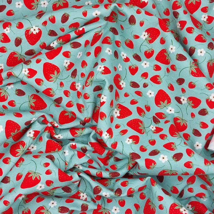 Tissu jersey fraises fond vert opaline – Jersey coton stretch Stof Oeko-Tex